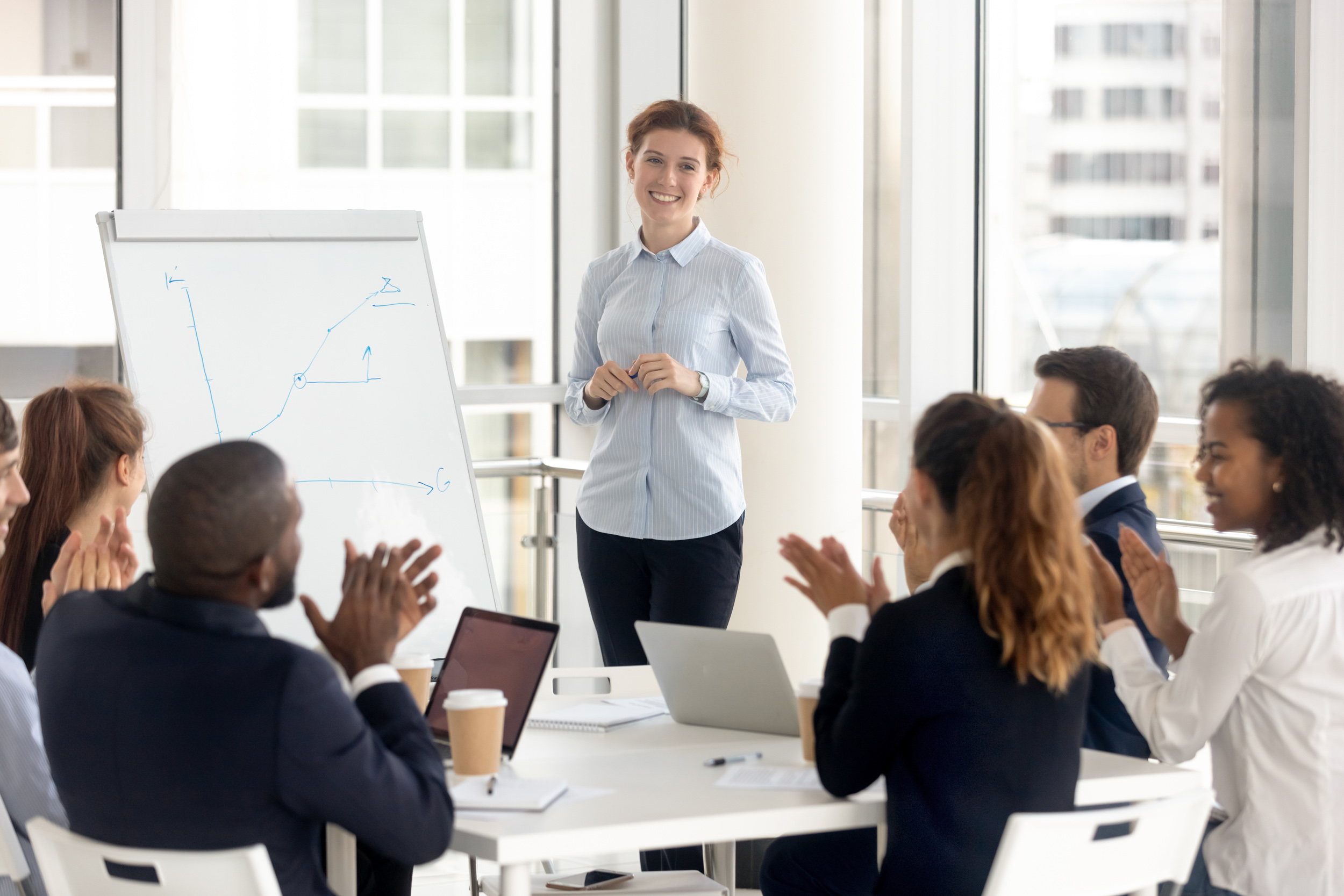 Multiethnic,Happy,Employees,Applaud,Thanking,Female,Speaker,For,Successful,Flip